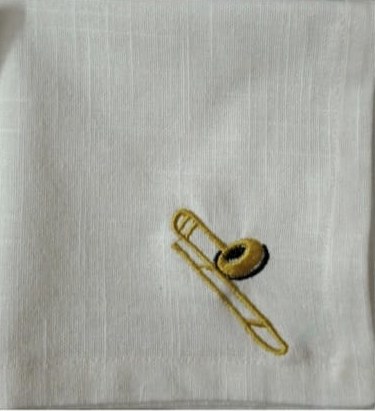 Linen napkin with trombone embroidery